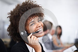 Customer service with a smile. Portrait of an attractive young female call center operator.
