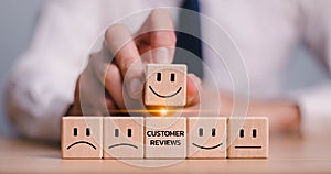 customer services best excellent business rating experience. Satisfaction survey concept. Hand of a businessman chooses a smile