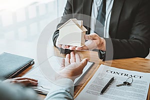 Customer sign agreement buying home ,salesman receive money after good deal after successful loan contract