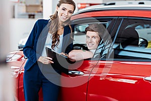 Customer sitting in a car, manager