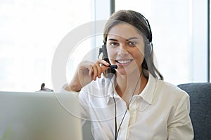 Customer support operator working in a call center office. photo