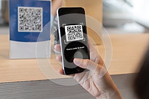 Customer using digital mobile phone scan QR code pay for buying coffee in cafe coffee shop, restaurant, digital payment, network s