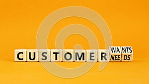 Customer wants and needs symbol. Concept words Customer wants or Customer needs on wooden cubes. Beautiful orange table orange