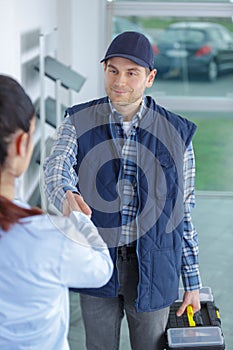 customer woman having handshake with technician