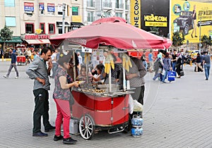 Customers buying boiled corn at Taksim Square