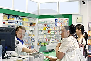 Customers inside a pharmacy shop