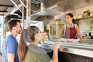 Customers making line in a food truck