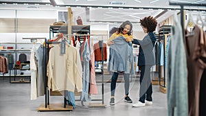 Customers Shopping in Modern Clothing Store, Retail Sales Associate Assists Client. Diverse People