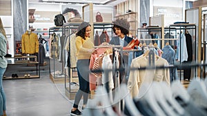 Customers Shopping in Modern Clothing Store, Retail Sales Associate Assists Client. Diverse People