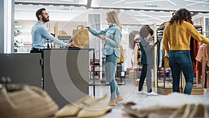 Customers Shopping in Modern Clothing Store, Retail Sales Associate Assists Client. Diverse People