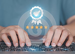 Customers using laptop to send satisfaction surveys with quality guarantee icon of 5 stars.