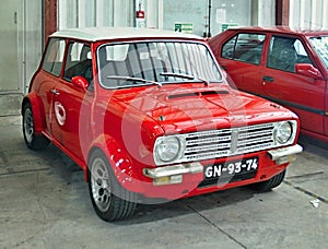Customized red Mini Cooper shining in a garage