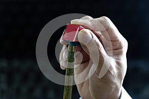 Customizing the head of the snooker cue to compete and adding to the snooker