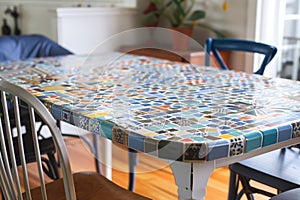 customizing a thrifted dining table with mosaic tiles