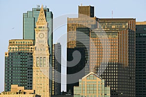 The Customs House Clock Tower and Boston skyline at sunrise, as seen from South Boston, Massachusetts, New England