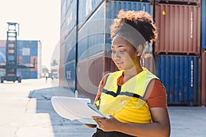 Customs officer working check on list board cargo container in port yard before shipping