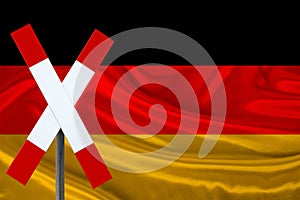 Customs sign, stop, attention against the background of the silk national flag of Germany, the concept of border and customs