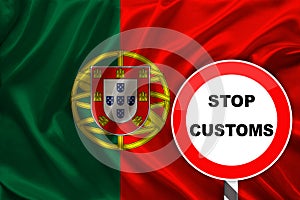 Customs sign, stop, attention against the background of the silk national flag of Portugal, the concept of border and customs
