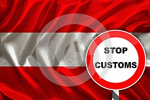 Customs sign, stop, attention on the background of the silk national flag of Austria, the concept of border and customs control,