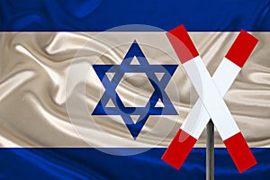 Customs sign, stop, attention on the background of the silk national flag of the country of Israel, the concept of border and