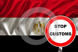 Customs sign, stop, attention on the background of the silk national flag of Egypt, the concept of border and customs control,