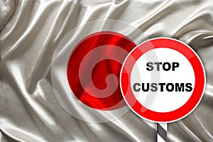 Customs sign, stop, attention on the background of the silk national flag of japan, the concept of border and customs control,