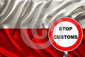 Customs sign, stop, attention on the background of the silk national flag of Poland, the concept of border and customs control,