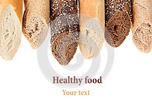 Cut baguette bread of different varieties on a white background.