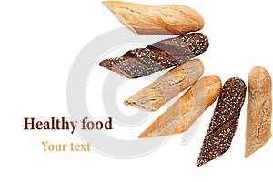 Cut baguette bread of different varieties on a white background.