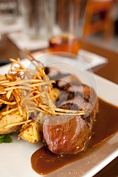 Cut beef steak frites with sauce photo