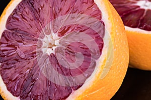 Cut blood orange on black