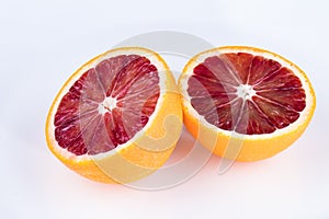 Cut blood orange on a white