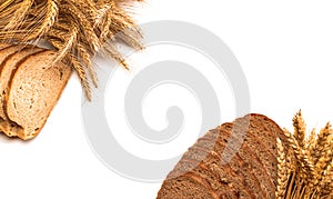 Cut bread. Fresh loaf of rustic traditional bread with wheat grain ear or spike plant isolated on white background. Rye bakery