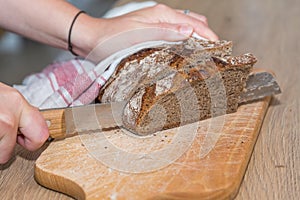 Cut the bread slice with a bread knife