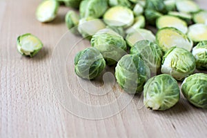 Cut brussels sprout lay flat on wooden board