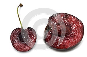 Cut of Cherry fruit over white