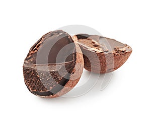 Cut chocolate truffle on white background