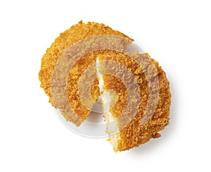 A cut croquette placed on a white background