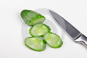 The cut cucumber with the knife