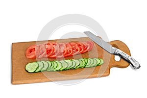 Cut cucumber and tomato on the wooden board