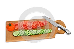 Cut cucumber and tomato on the wooden board