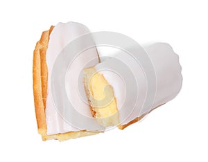 Cut delicious eclair covered with glaze isolated on white, top view