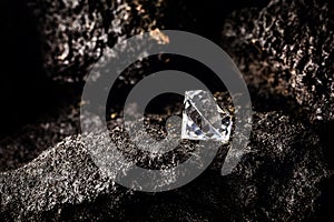 Cut diamond on kimberlite rock, on isolated background, rare jewelry concept