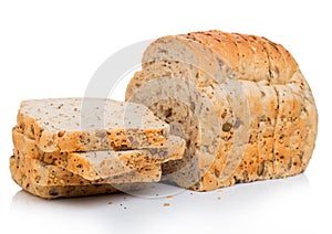 Cut of fresh loaf of seeded brown bread on white background. Traditional bakery heritage