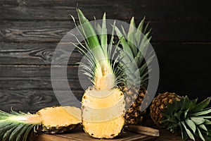 Cut fresh juicy pineapple on wooden board