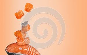 Cut fresh salmon falling on coral gradient background, space for text