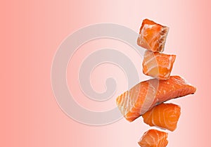 Cut fresh salmon falling on pink gradient background, space for text