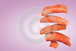 Cut fresh salmon falling on violet gradient background, space for text