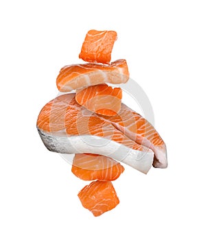 Cut fresh salmon falling on white