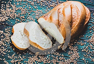 Cut Fresh wheat bread with grains around